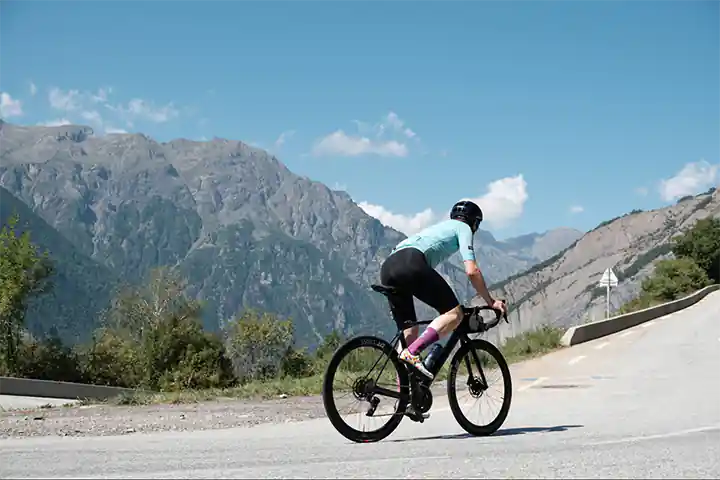 a person riding a bike on a road