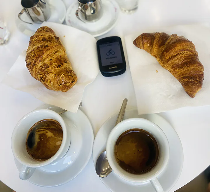 a croissants and coffee on a table